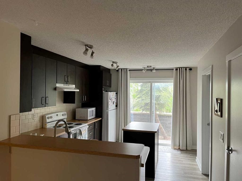 2-bed Townhouse for sale at 303, 2445 Kingsland Road SE, Airdrie