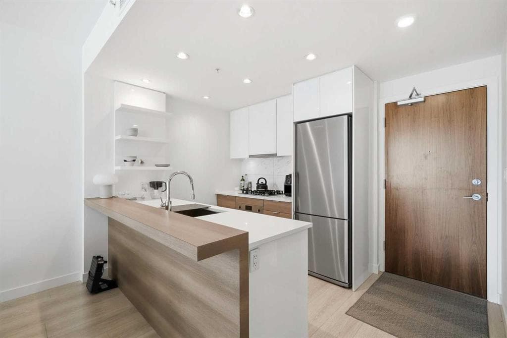 303, 138 waterfront Court SW — photo 1